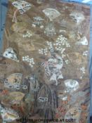 A large Japanese Meiji period embroidered wall hanging depicting pagodas and storks with gold