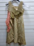 A Georgian ladies evening/ball gown in silk satin with very fine gold thread embroidered foliate