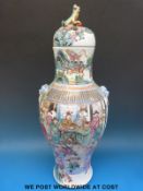 A large 19thC Chinese lidded vase with foo dog handles and finial and figural decoration (66cm