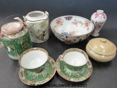 A collection of Chinese ceramics to include famille rose cups and saucers, teapots,