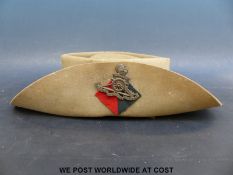 A World War II Australian military felt bush hat together with a black and white contemporary photo