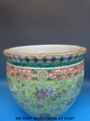A large 19thC Chinese famille verte fish bowl with interior decoration of fish (31cm tall,