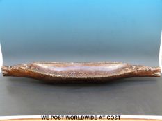 A tribal elongated hardwood bowl (length 94cm)