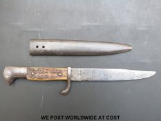 A stag's horn handled trench knife, probably German, in metal sheath,