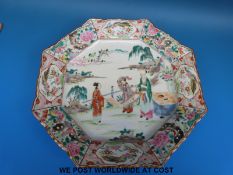 A Chinese hexagonal charger decorated with figures in enamels (31cm diameter)