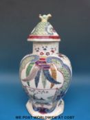 An 18th/19thC Chinese lidded vase decorated with two central figural cartouches surrounded by