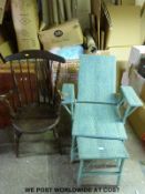 A 19thC elm seated armchair and a Lloyd Loom style steamer with pull out foot rest