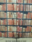 An adjustable height reading or standard lamp with riveted legs and fittings (height 174cm)