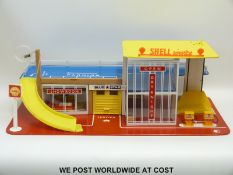 A Tri-ang two tier Shell model car garage