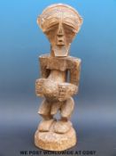 An African tribal maternity figure of a pregnant woman (44cm tall)