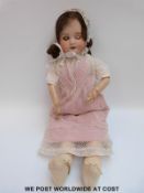 Societe Francaise de Fabrication et Jouets (SFBJ) bisque headed doll with open mouth,