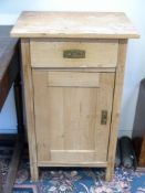 A pine bedside cabinet with single drawer above a cupboard (W48cm)