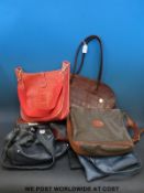 A collection of ladies handbags