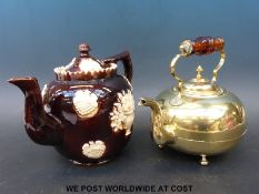 A bargeware teapot and a brass example