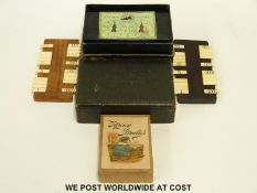 Bezique set in original leather case and a set of Happy Families playing cards,