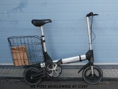 A Sinclair Zike electric bicycle and charger.