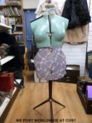 A retro adjustable dressmaker's mannequin