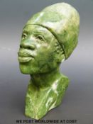 A carved soapstone African or tribal bust, marked 'by A.R.
