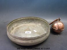 An Indian/Eastern bowl together with a heavy throwing weight or doorstop,