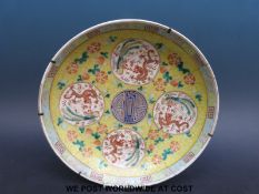 An 18th/19thC Chinese plate with yellow ground,