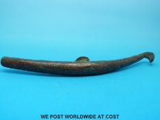 An early Chinese bronze belt hook with yellow metal inlay and remains of red enamelling