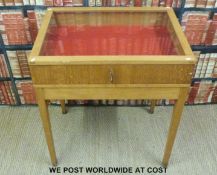 A solid oak free standing jewellery display cabinet with glazed top,