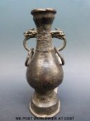 A Chinese Yuan/ Ming bronze vase with ring handles (16cm tall)
