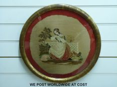 Two framed circular embroideries, late 19thC, one of a lady on a stone bench with bird,