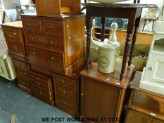 A bedroom set including cabinets, three chests of drawers, dressing table, stool,