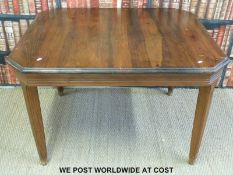 A stained pine dining table (L112 x W100 x H74cm)