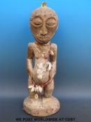 An African tribal maternity figure of a pregnant woman,