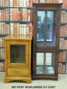 A modern hi-fi or similar cabinet (H169 x W61 x D34cm) together with a modern glazed display