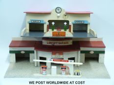 Two wooden model car garages,