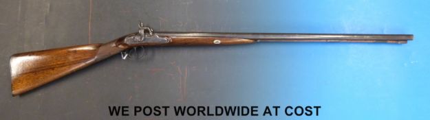 A 20 bore percussion hammer action double barrelled side by side shotgun with stepped locks,