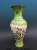 A Chinese enamel vase with landscape scene and a bird scene with green ground and pink flowers