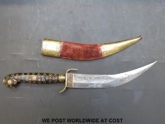 An Indian jambiya dagger with engraved 18cm curved blade, brass inlaid horn handle and coral beads,
