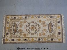 Two Tibetan hand made rugs (183 x 92cm)
