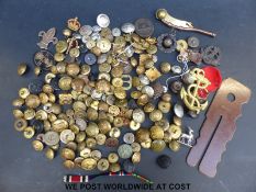 A box of miscellaneous military badges and buttons including Nazi German,