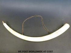 A Japanese Meiji period finely carved elephant ivory tusk.