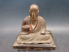 A Japanese 17th/18thC Buddha with calligraphy to base (16cm tall)