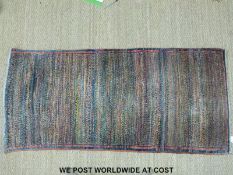 A multicoloured wool rug (170 x 80cm)