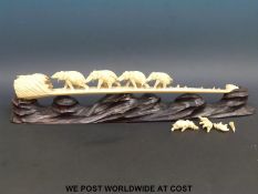 An ivory elephant train on stand (length 52cm)