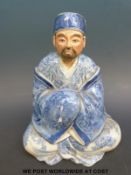 A 19thC Chinese blue and white figure of a scholar (19cm high)
