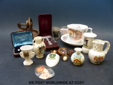 A small collection of items to include crested ware, cased horseshoe themed studs, insect brooch,