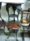 Two mahogany and cast iron pub tables (H70cm,