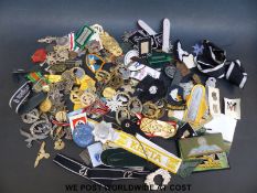 A quantity of mainly WWII German style militaria and badges