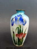 A Japanese ginbari enamel vase decorated with flowers on a blue ground (12cm tall)
