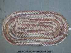 A braided Welsh rug and a raffia mat