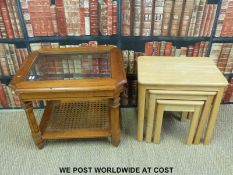A glazed coffee table and one other nest of tables