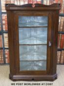 A glazed oak corner cupboard (height 116cm)